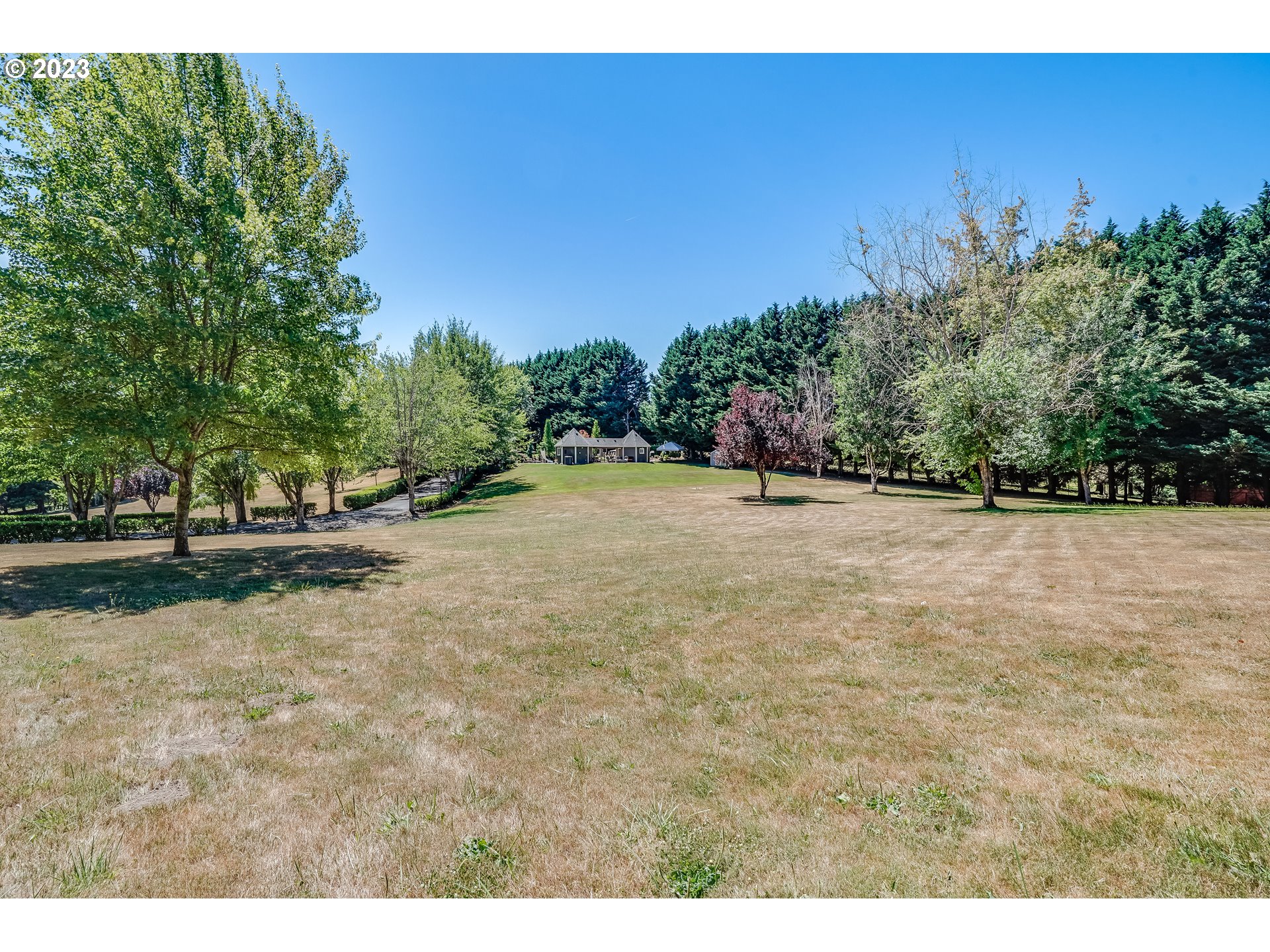 21418 Northwest 11th Avenue Ridgefield, WA 98642 - Photo 36 of 42 a view of an outdoor space and a yard