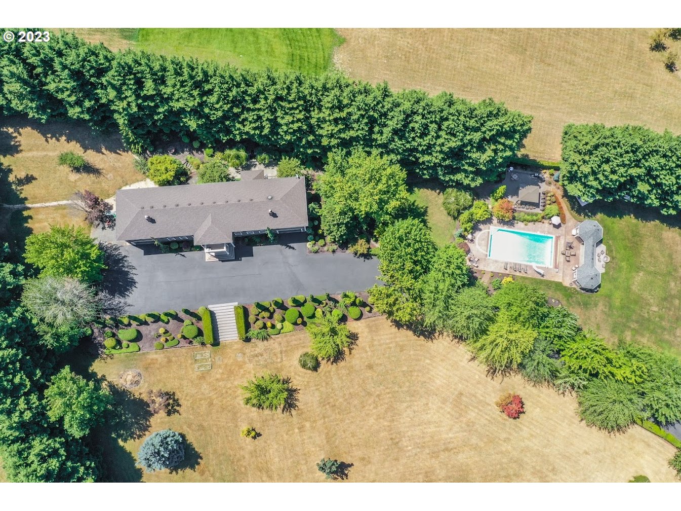 21418 Northwest 11th Avenue Ridgefield, WA 98642 - Photo 40 of 42 an aerial view of a house with a yard and lake view
