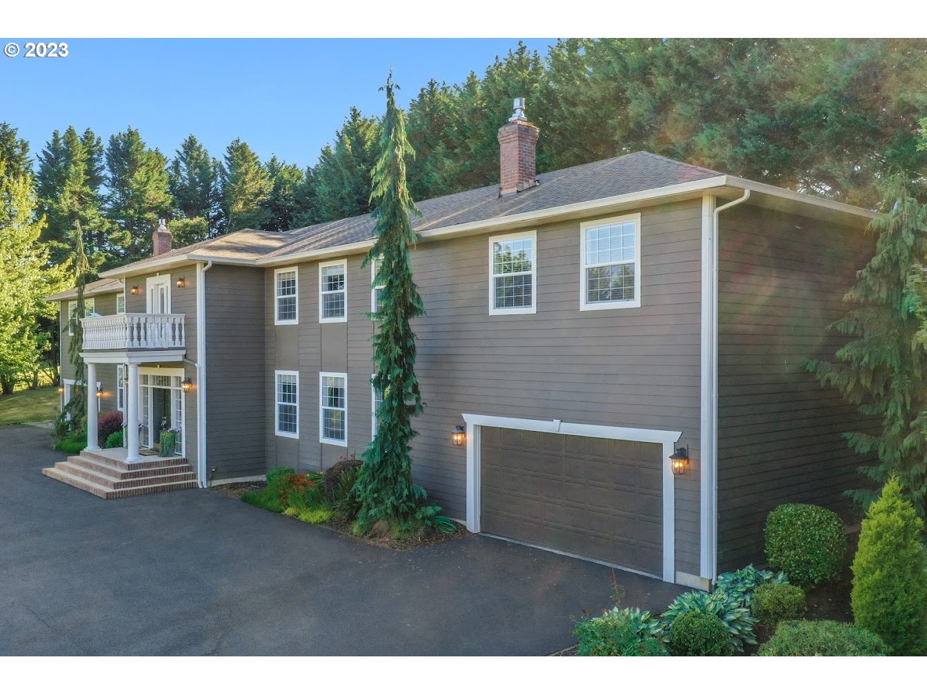 21418 Northwest 11th Avenue Ridgefield, WA 98642 - Photo 42 of 42 a front view of a house with a yard