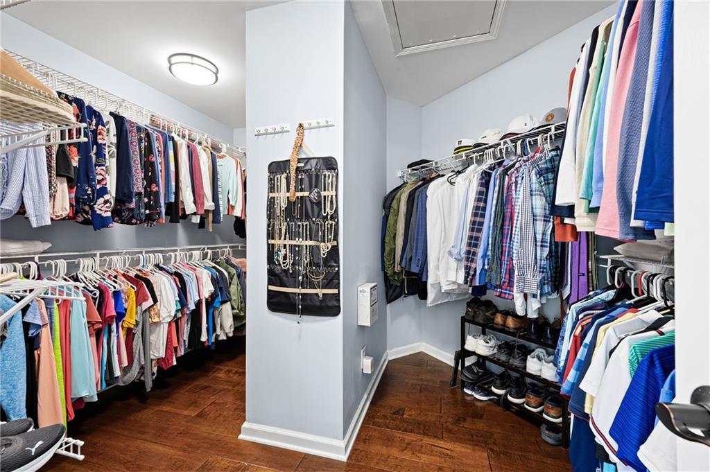 204 Golden Bell Way Canton, GA 30115 - Photo 33 of 81 a view of walk in closet with clothes