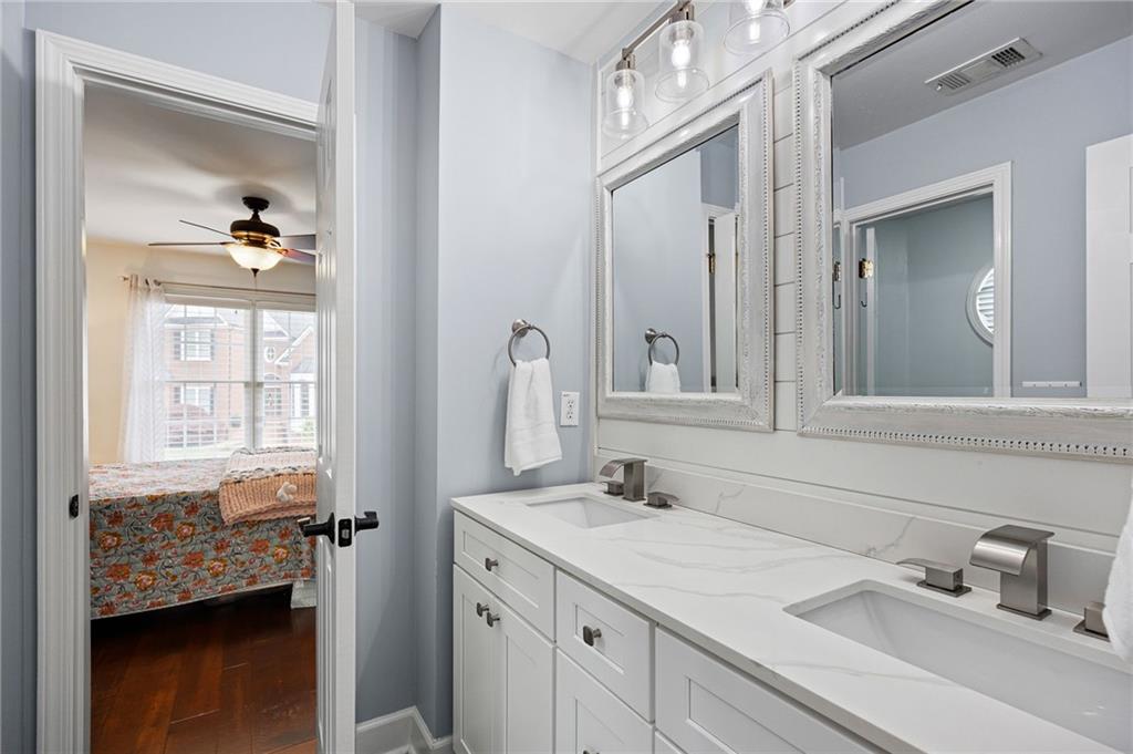 204 Golden Bell Way Canton, GA 30115 - Photo 35 of 81 a bathroom with a sink double vanity and a mirror