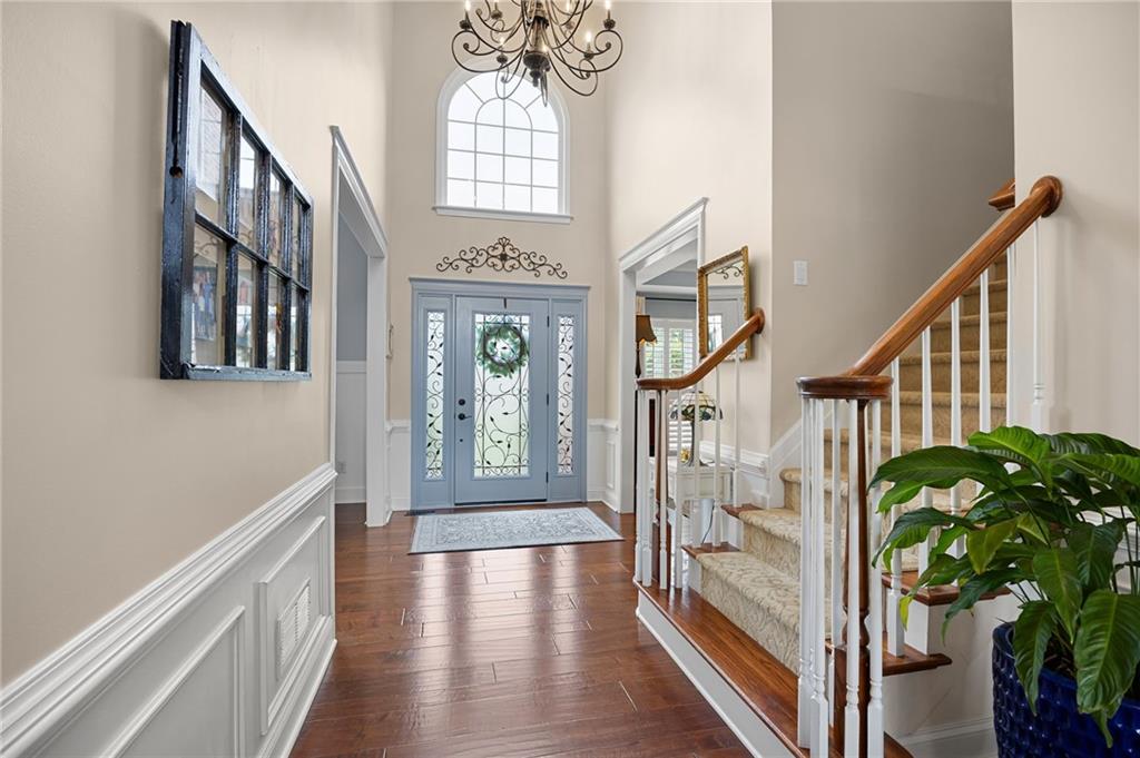 204 Golden Bell Way Canton, GA 30115 - Photo 4 of 81 a view of an entryway with wooden floor and windows