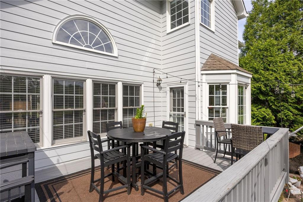 204 Golden Bell Way Canton, GA 30115 - Photo 66 of 81 a view of a house that has a table and chairs in patio