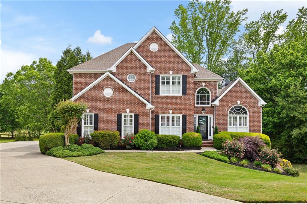 204 Golden Bell Way Canton, GA 30115 - Photo 71 of 81 a front view of a house with a yard
