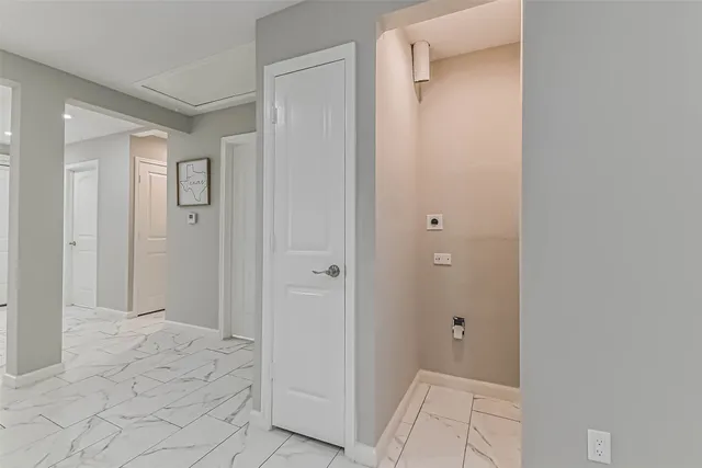 a view of a bathroom from the hallway