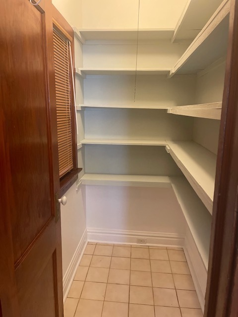 209 Circle Avenue, Unit 1 Forest Park, IL 60130 - Photo 3 of 9 a view of walk in closet with empty racks