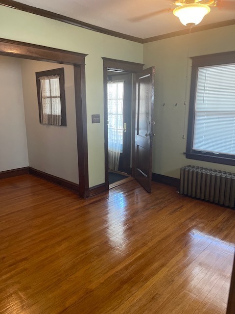 209 Circle Avenue, Unit 1 Forest Park, IL 60130 - Photo 9 of 9 a view of an empty room with wooden floor and a window