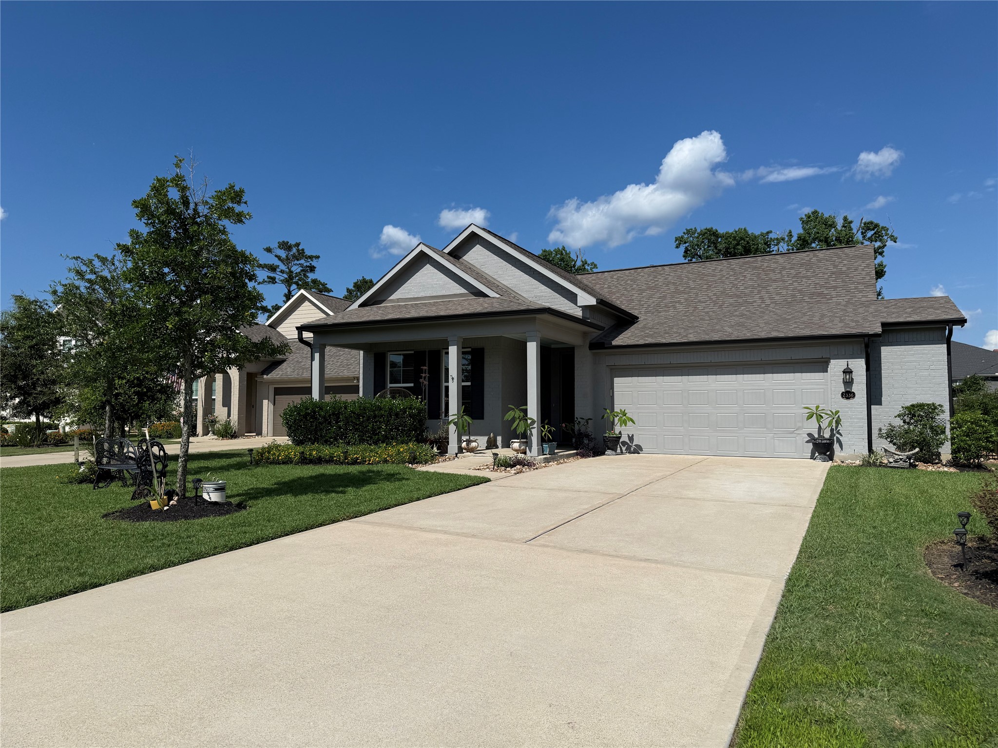a front view of a house with garden