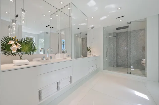 a bathroom with a bathtub and a shower