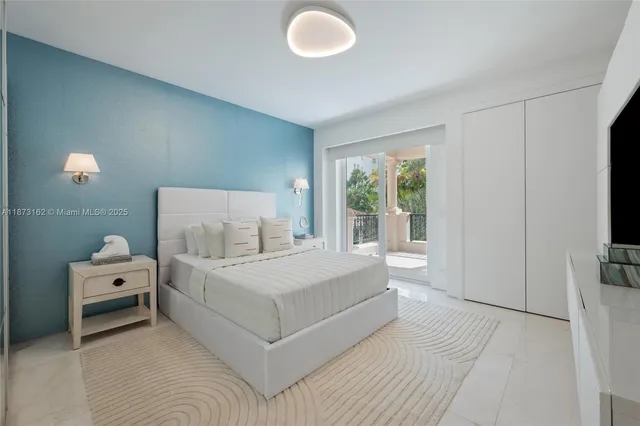 a large white bed in a white room