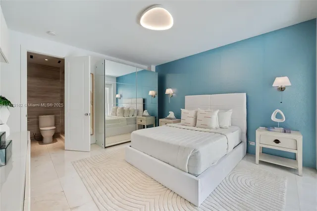 a living room with a bed and a flat screen tv