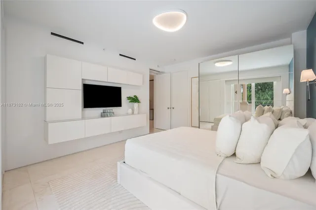 a bathroom with a toilet and shower