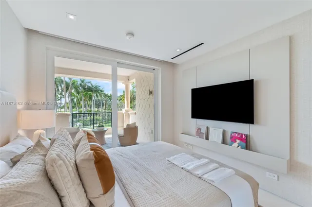 a view of a living room and a balcony
