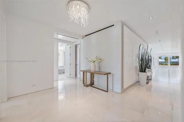 a view of a patio with chairs and potted plants