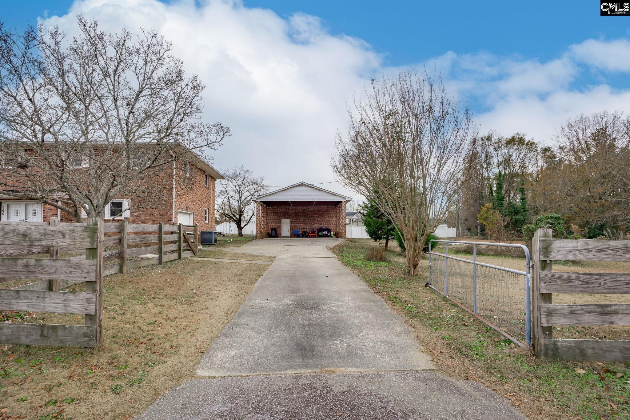 560 Edisto Street Batesburg, SC 29006 - Photo 47 of 49 a view of house with outdoor space and trees