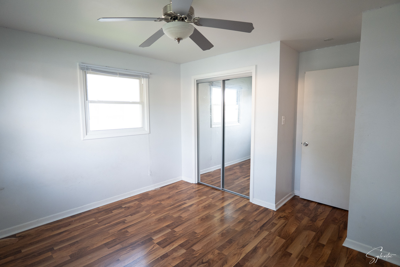 904 Chippewa Drive Elgin, IL 60120 - Photo 16 of 35 a view of empty room with wooden floor and fan
