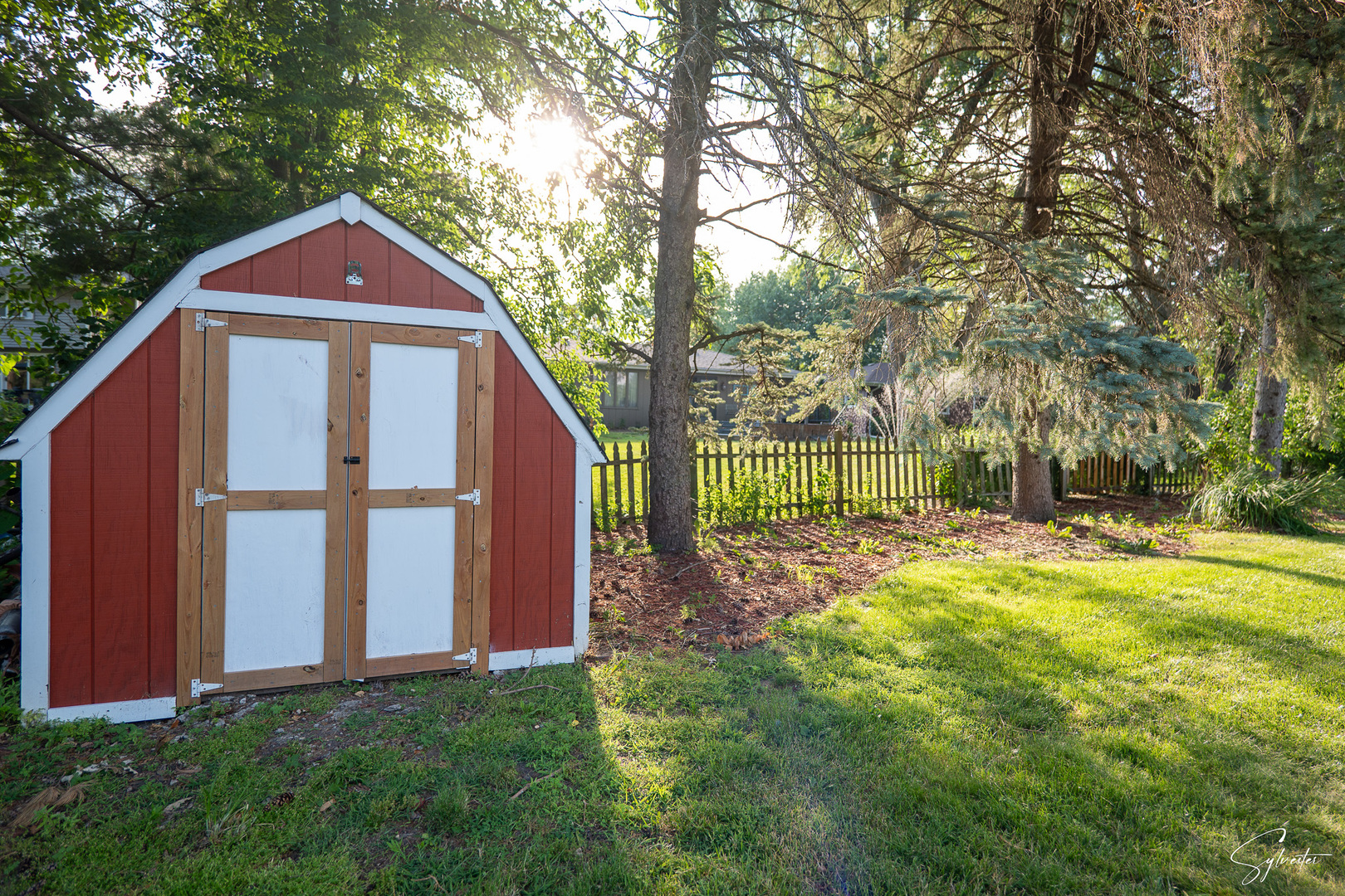 904 Chippewa Drive Elgin, IL 60120 - Photo 28 of 35 a view of a house with backyard and trees
