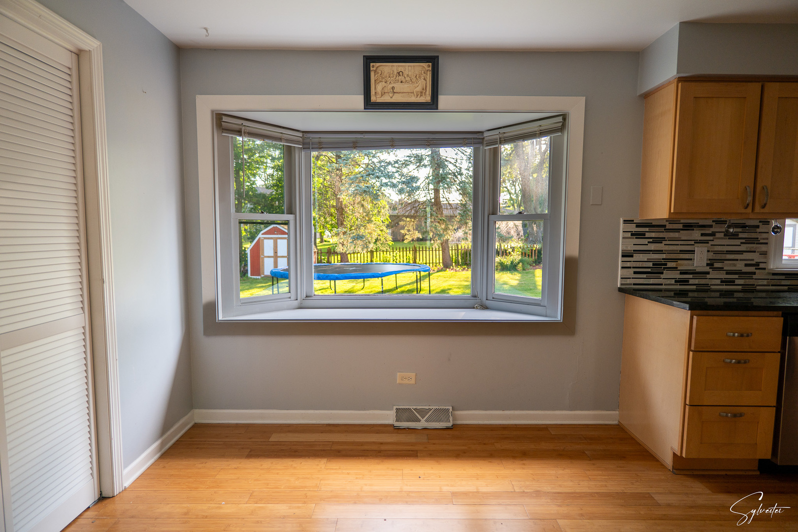 904 Chippewa Drive Elgin, IL 60120 - Photo 9 of 35 wooden floor in an empty room with a window