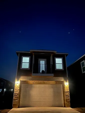 a front view of a house with yard