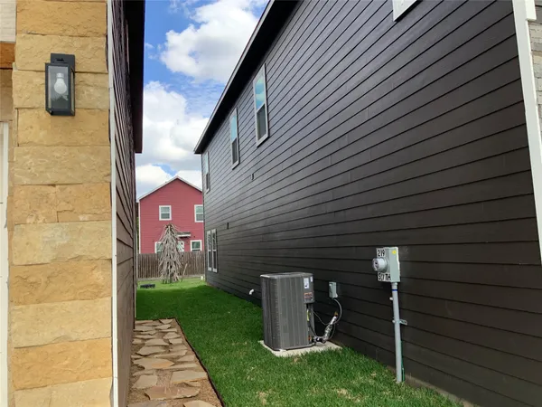 a view of a patio with table and chairs and potted plants