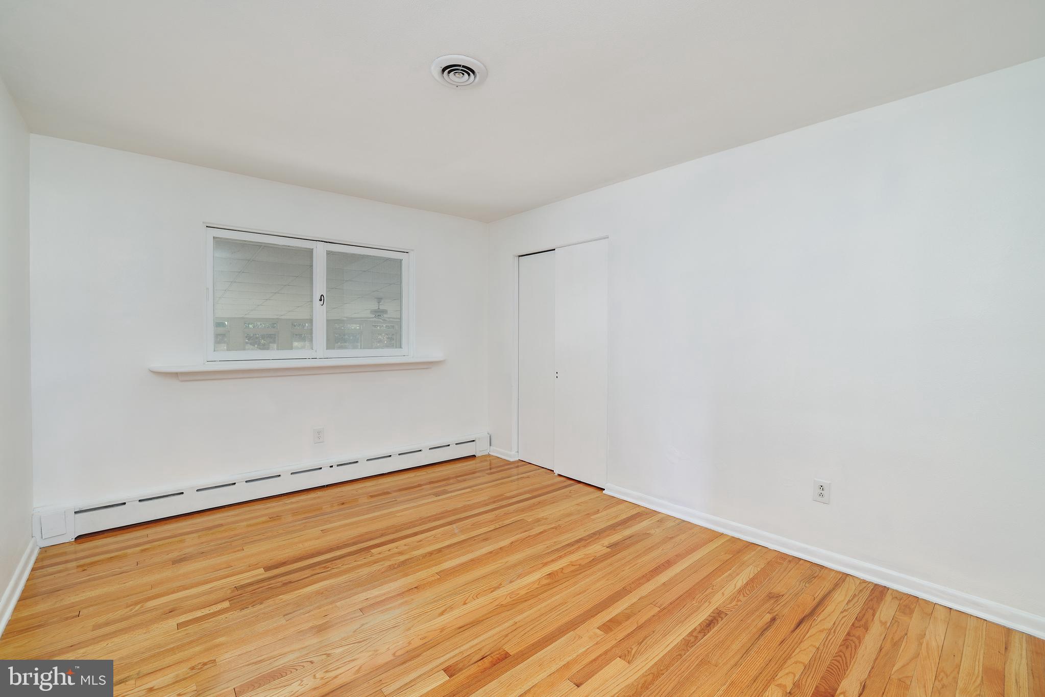2627 Pennington Road Pennington, NJ 08534 - Photo 16 of 31 a view of empty room with wooden floor and fan