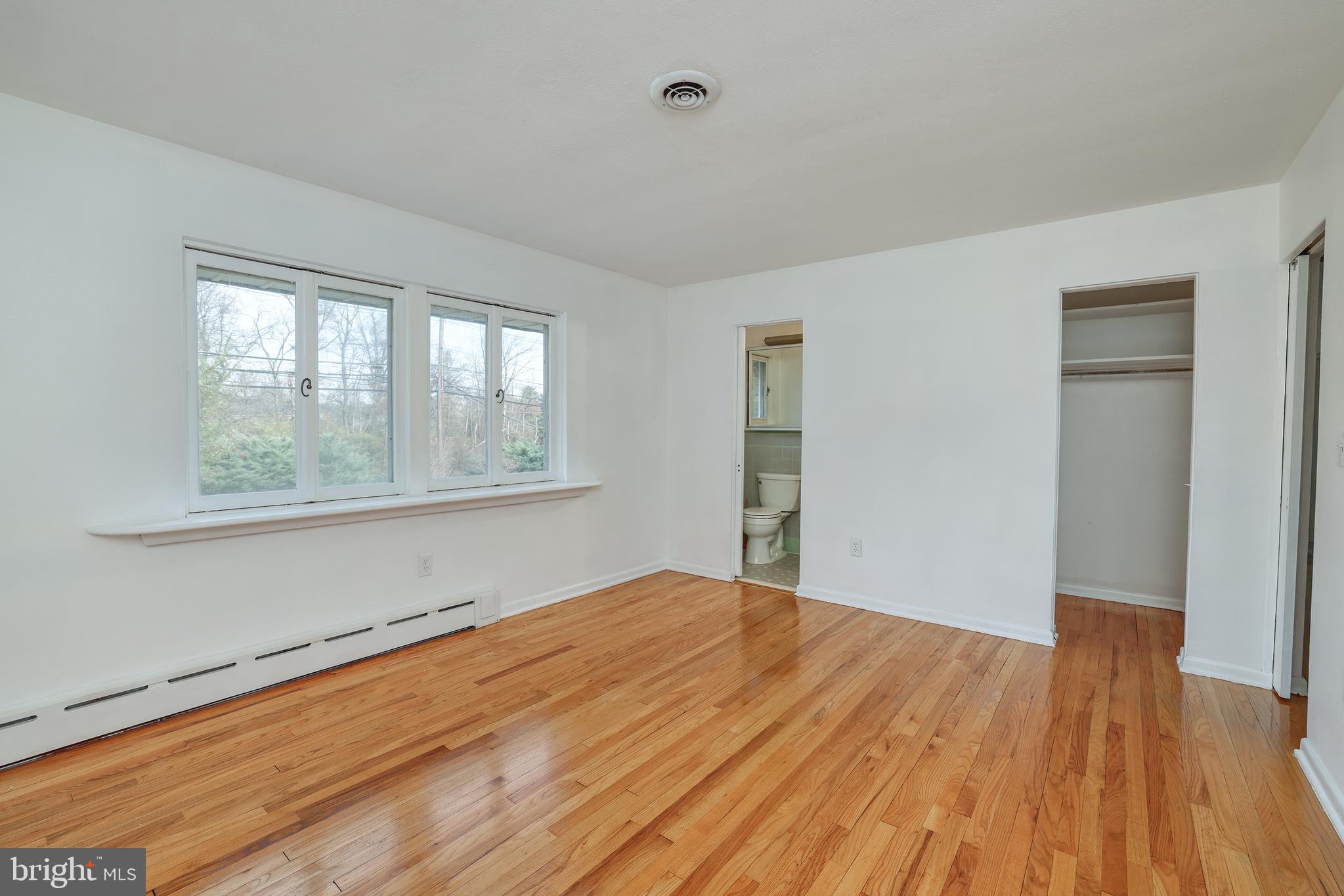 2627 Pennington Road Pennington, NJ 08534 - Photo 23 of 31 a view of empty room with wooden floor and fan