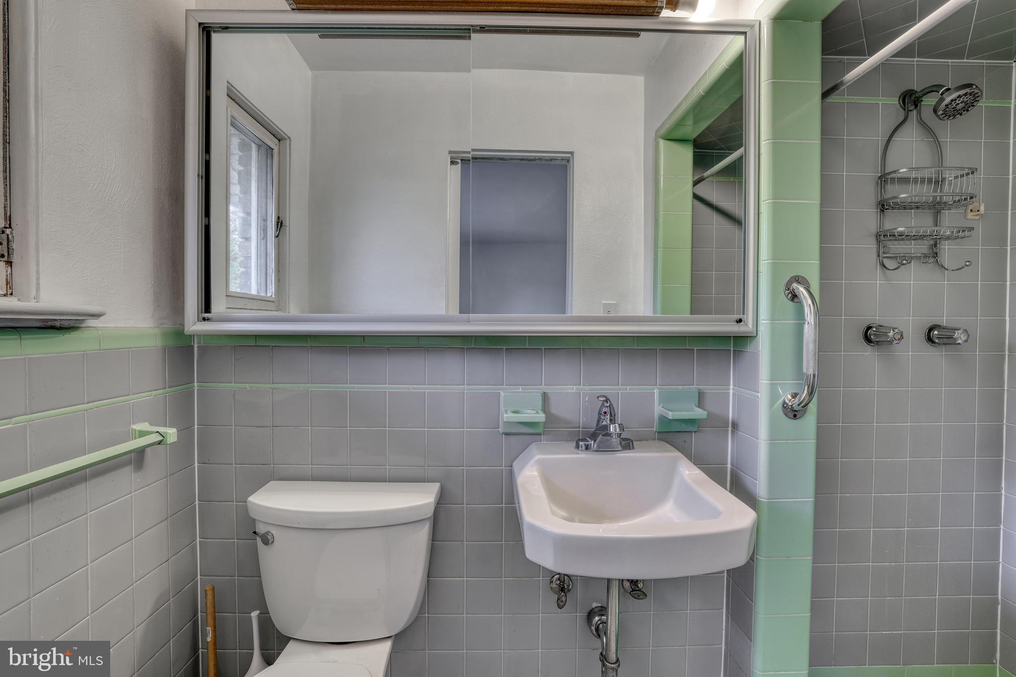 2627 Pennington Road Pennington, NJ 08534 - Photo 24 of 31 a bathroom with a toilet sink and mirror