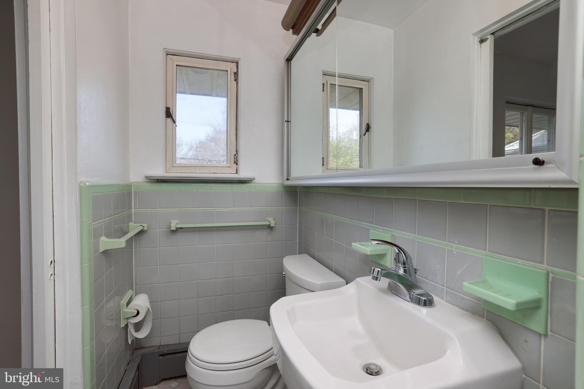 2627 Pennington Road Pennington, NJ 08534 - Photo 25 of 31 a bathroom with a sink and a toilet