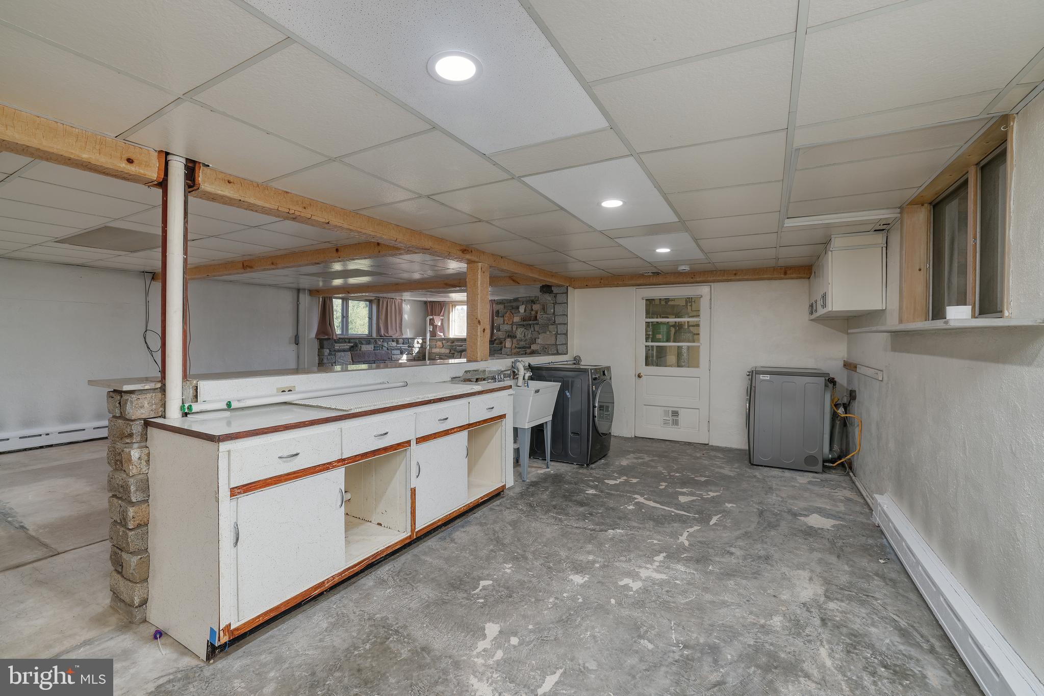 2627 Pennington Road Pennington, NJ 08534 - Photo 27 of 31 a kitchen with stainless steel appliances granite countertop a stove a sink and a refrigerator