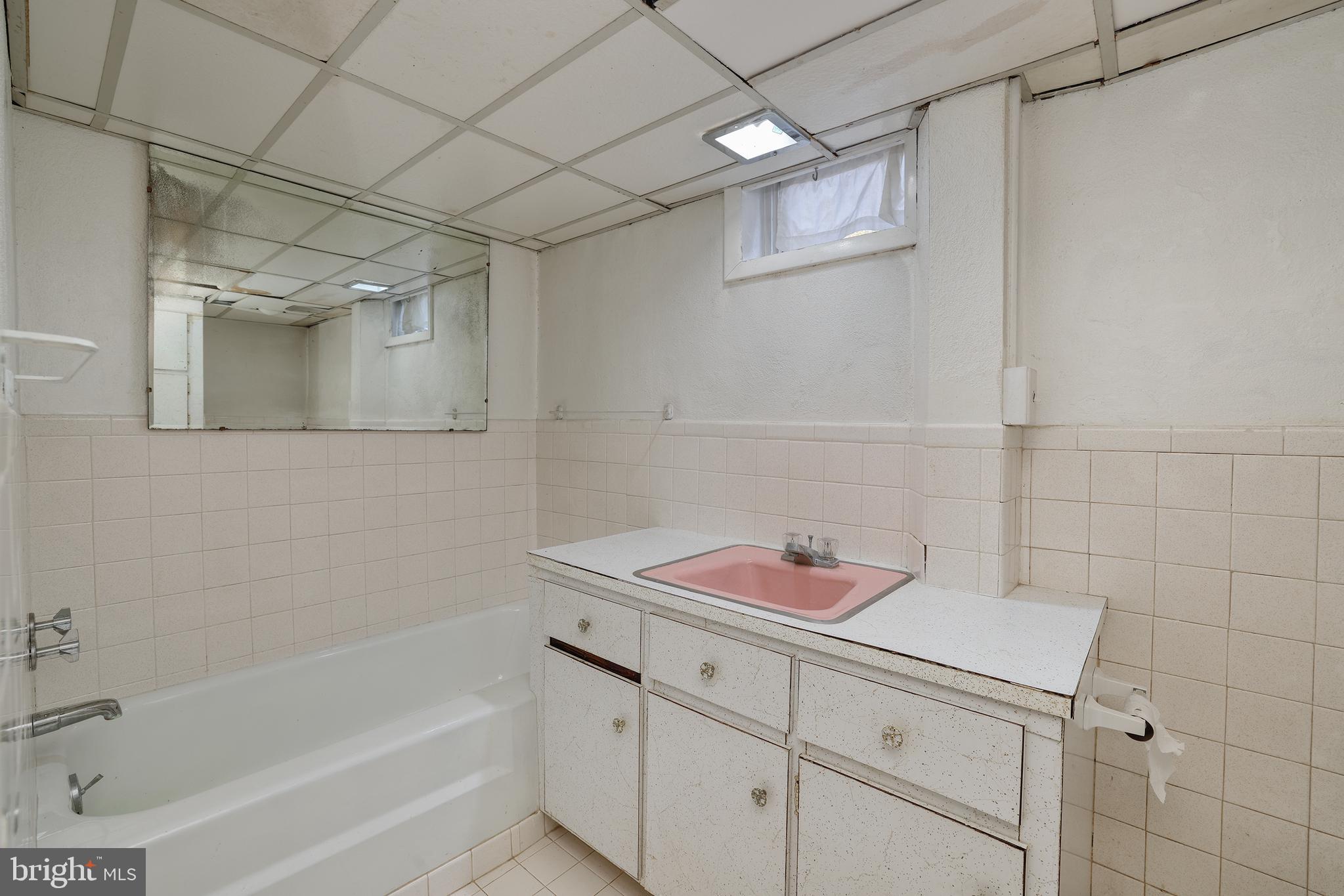 2627 Pennington Road Pennington, NJ 08534 - Photo 28 of 31 a bathroom with a bathtub sink vanity and mirror
