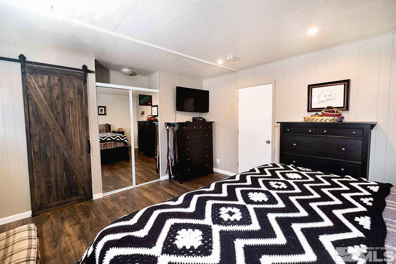 200 Gemini Circle Reno, NV 89521 - Photo 12 of 31 a bedroom with a bed and a television