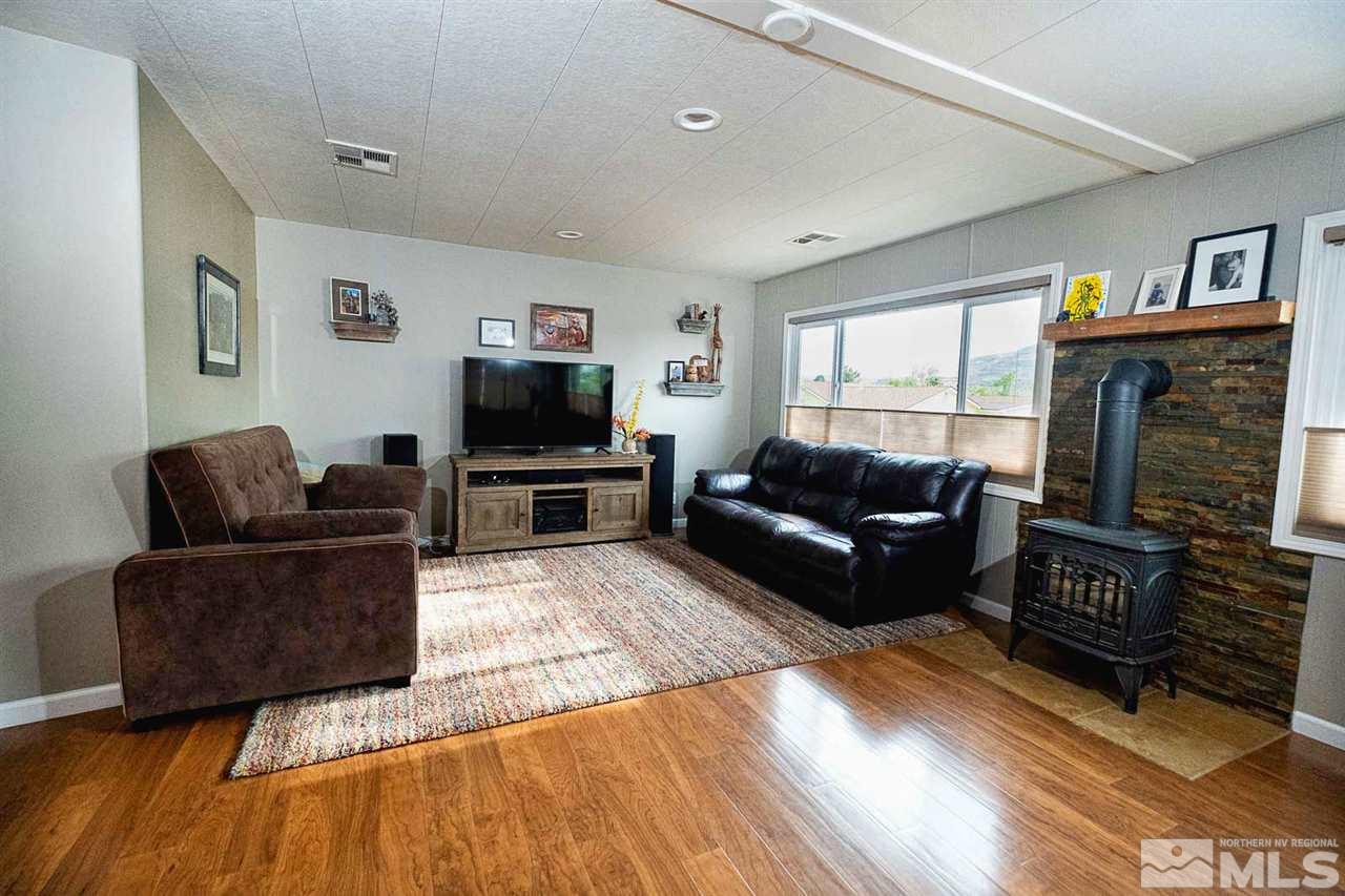 200 Gemini Circle Reno, NV 89521 - Photo 2 of 31 a living room with furniture and a flat screen tv