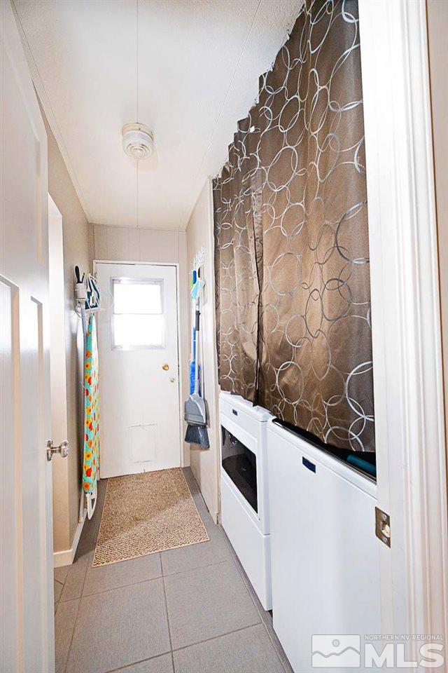 200 Gemini Circle Reno, NV 89521 - Photo 23 of 31 a kitchen with a refrigerator and a stove
