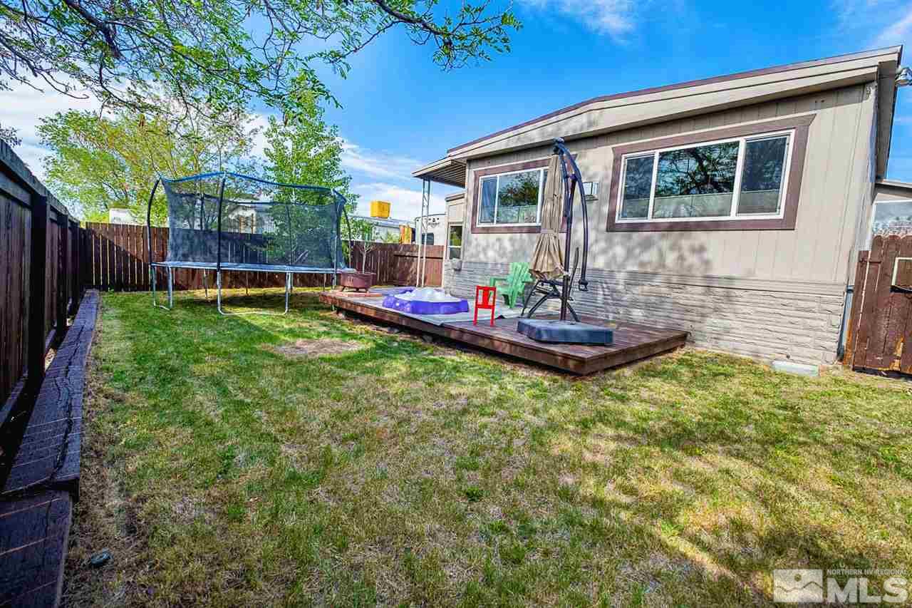 200 Gemini Circle Reno, NV 89521 - Photo 26 of 31 a front view of house with yard outdoor seating and barbeque oven