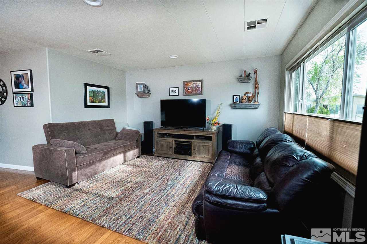 200 Gemini Circle Reno, NV 89521 - Photo 3 of 31 a living room with furniture and a flat screen tv