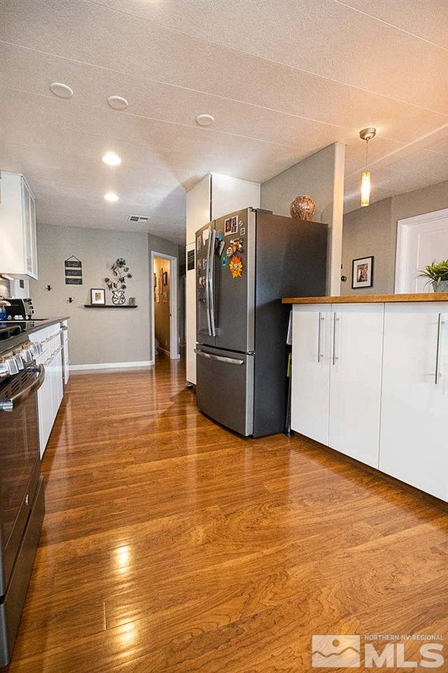 200 Gemini Circle Reno, NV 89521 - Photo 7 of 31 a view of a kitchen with stainless steel appliances granite countertop a refrigerator and a sink