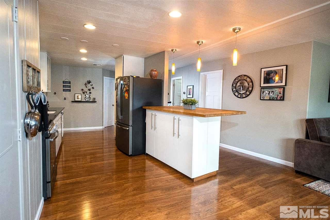 200 Gemini Circle Reno, NV 89521 - Photo 8 of 31 a view of a kitchen with refrigerator and a stove