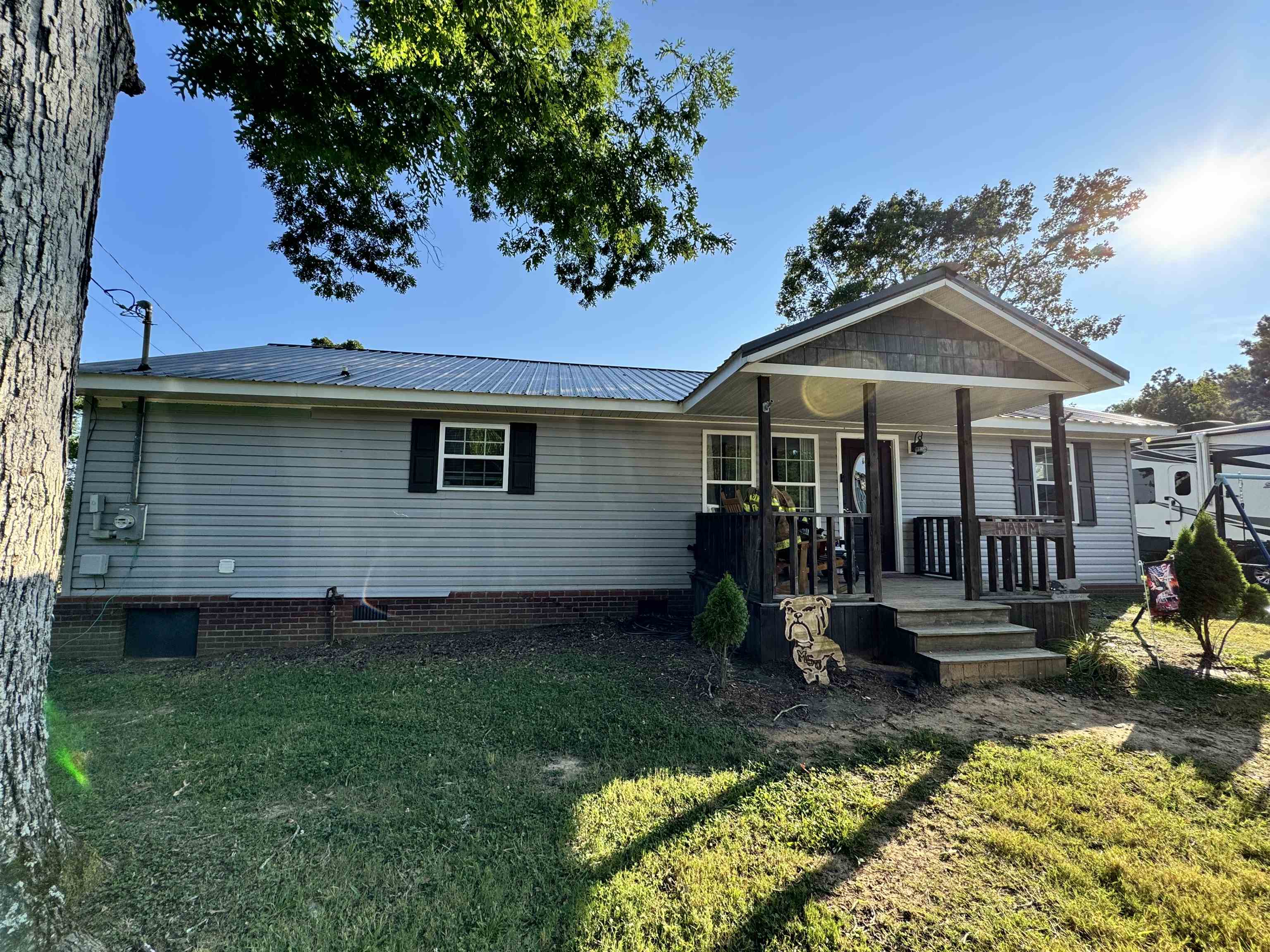 780 Ammons Road Selmer, TN 38375 - Photo 1 of 21 View of front facade with a front lawn