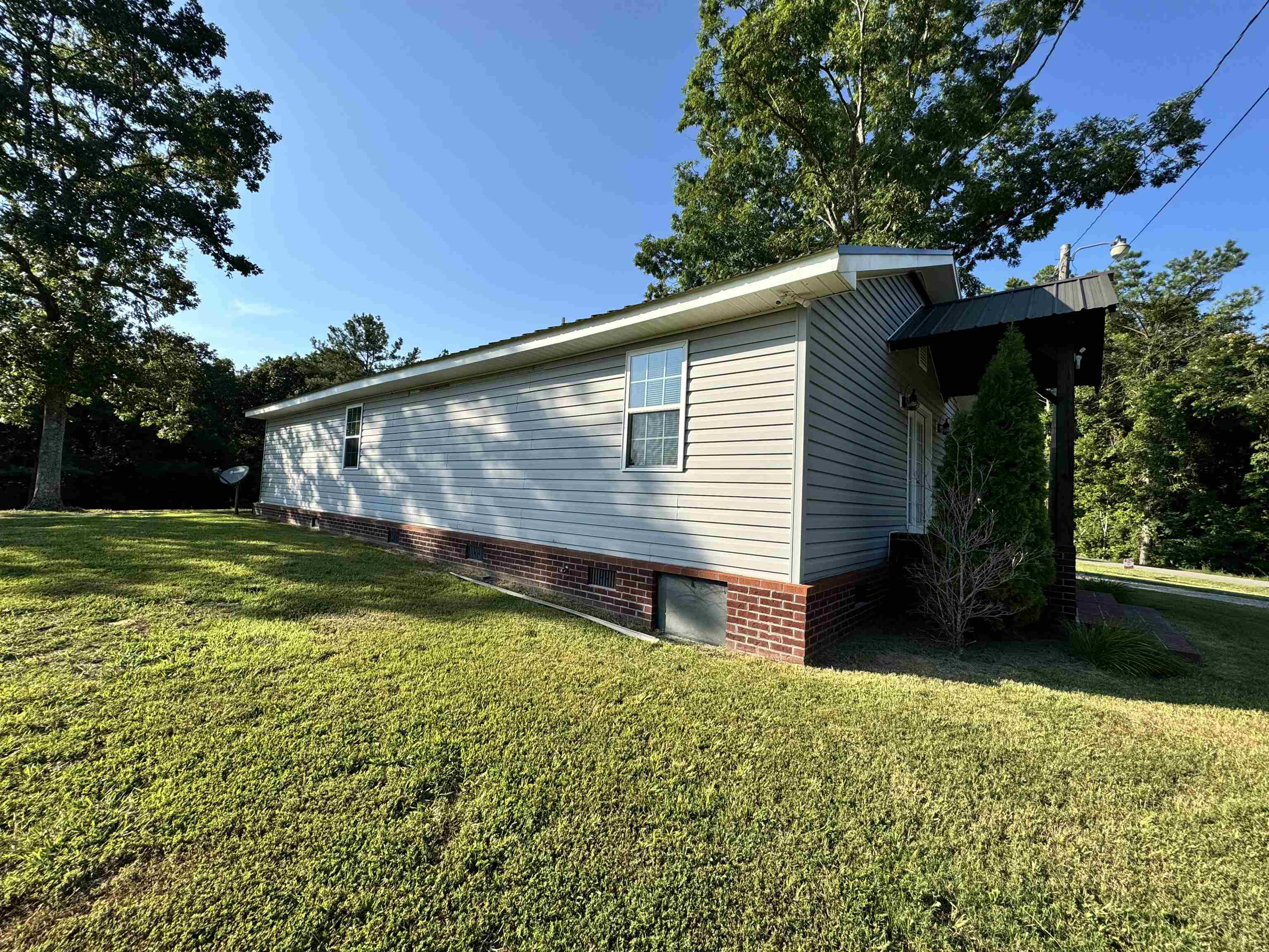 780 Ammons Road Selmer, TN 38375 - Photo 17 of 21 View of side of property with a yard