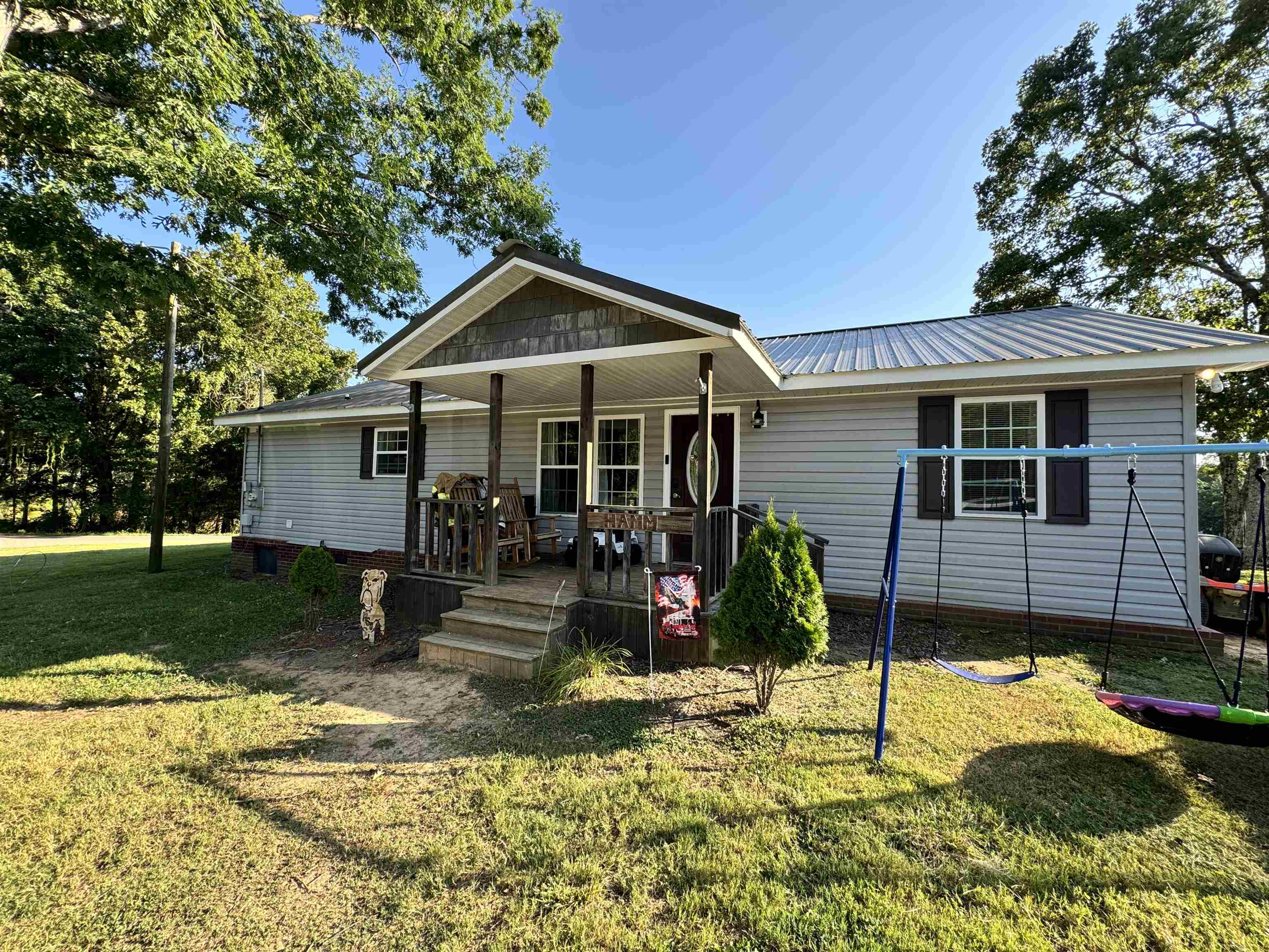780 Ammons Road Selmer, TN 38375 - Photo 19 of 21 View of front of property featuring a porch and a front yard