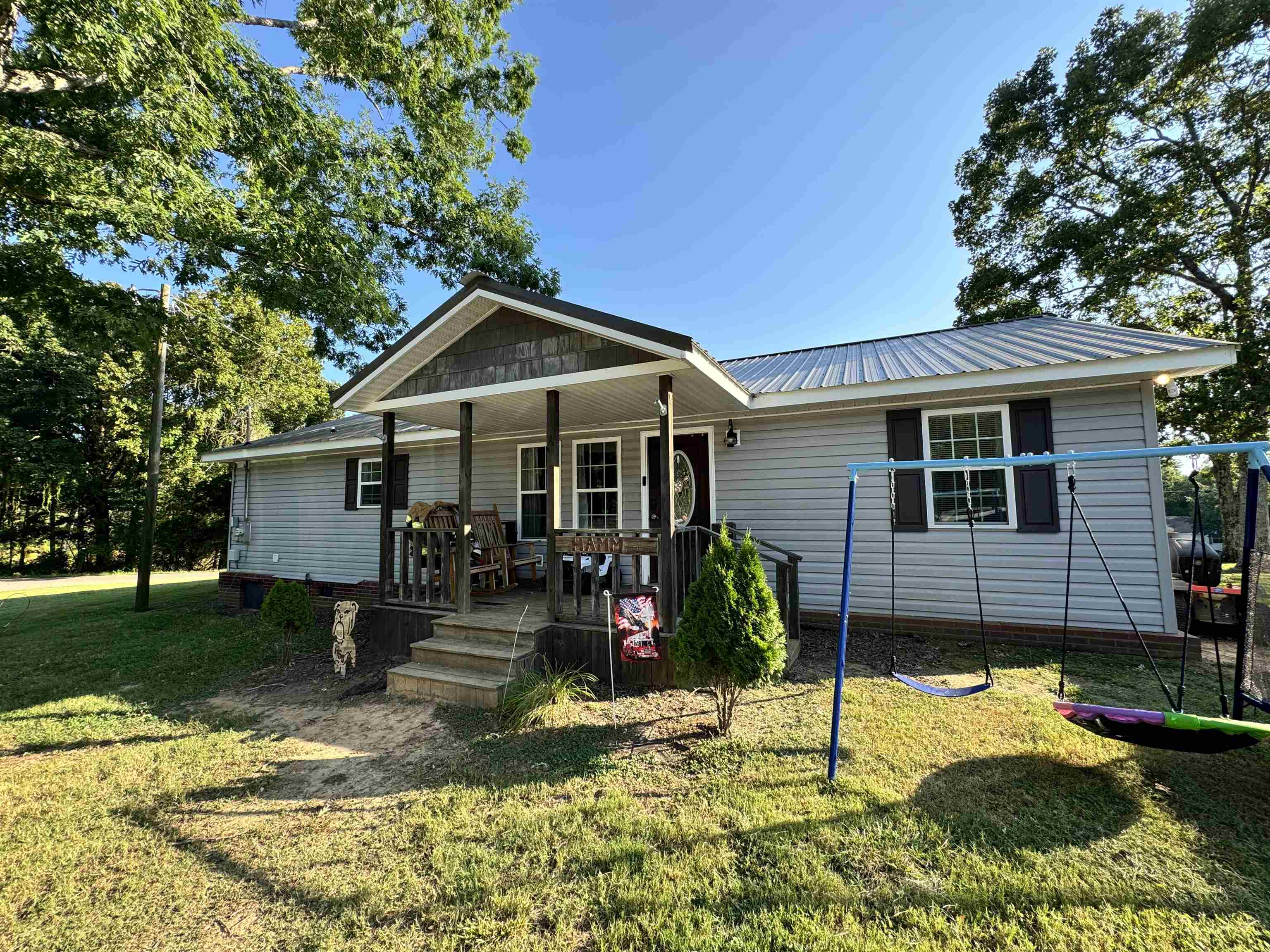 780 Ammons Road Selmer, TN 38375 - Photo 20 of 21 View of front of property featuring covered porch and a front yard