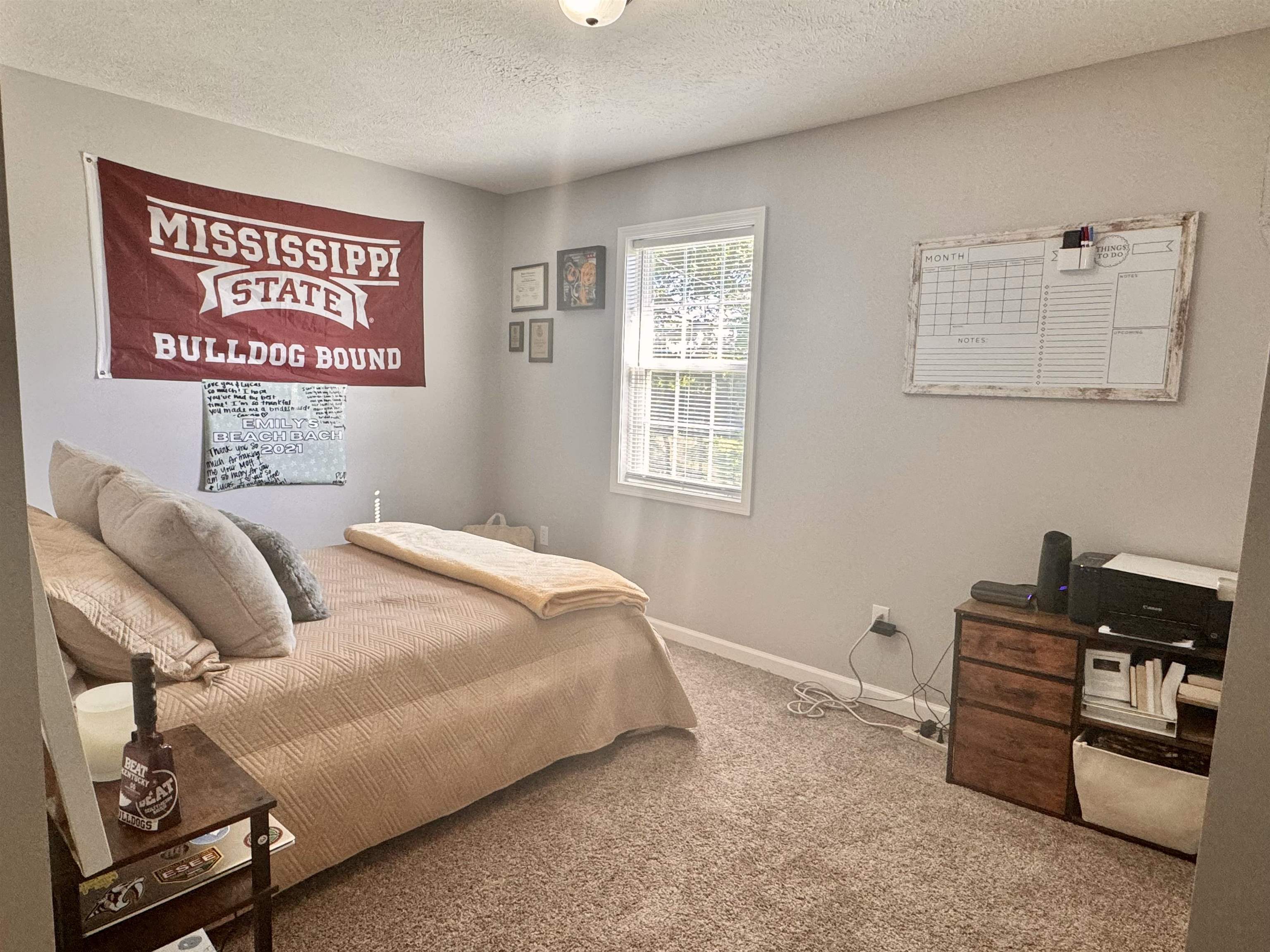 780 Ammons Road Selmer, TN 38375 - Photo 9 of 21 Carpeted bedroom featuring a textured ceiling
