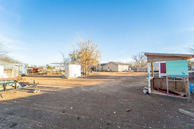 a view of a street with cars parked