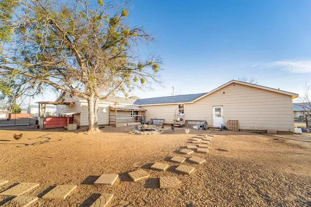 a view of a yard covered in snow