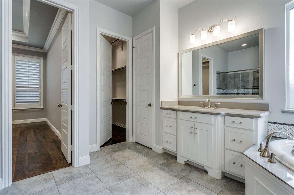 404 Bennington Lane Keller, TX 76248 - Photo 24 of 38 a bathroom with a sink and a mirror