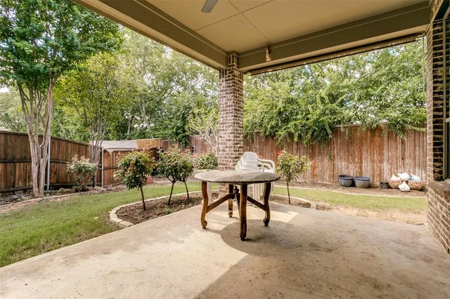 a garden view with a seating space