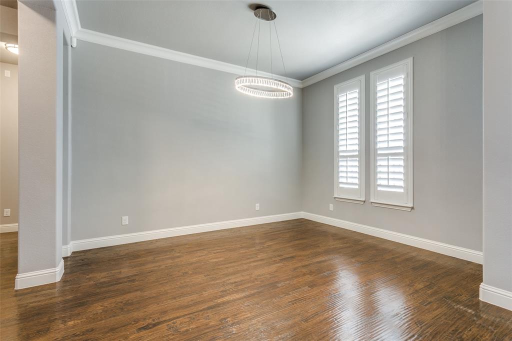 404 Bennington Lane Keller, TX 76248 - Photo 7 of 38 a view of an empty room with wooden floor and a window