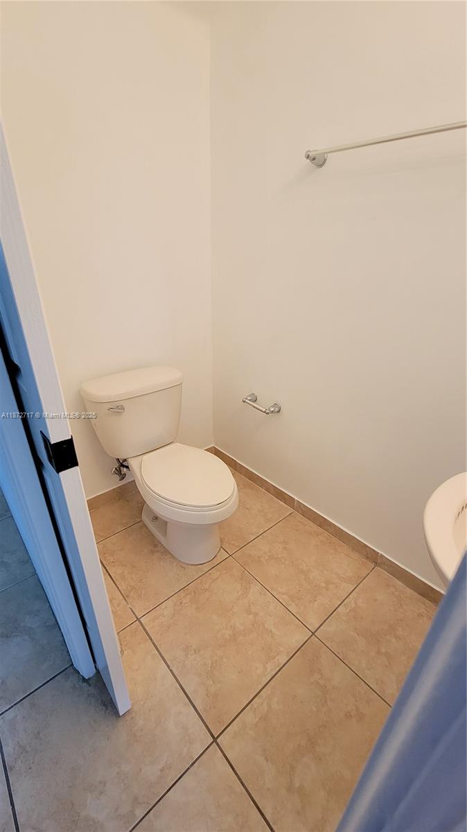12600 Southwest 50th Court, Unit 437 Miramar, FL 33027 - Photo 12 of 28 a bathroom with a toilet and a sink
