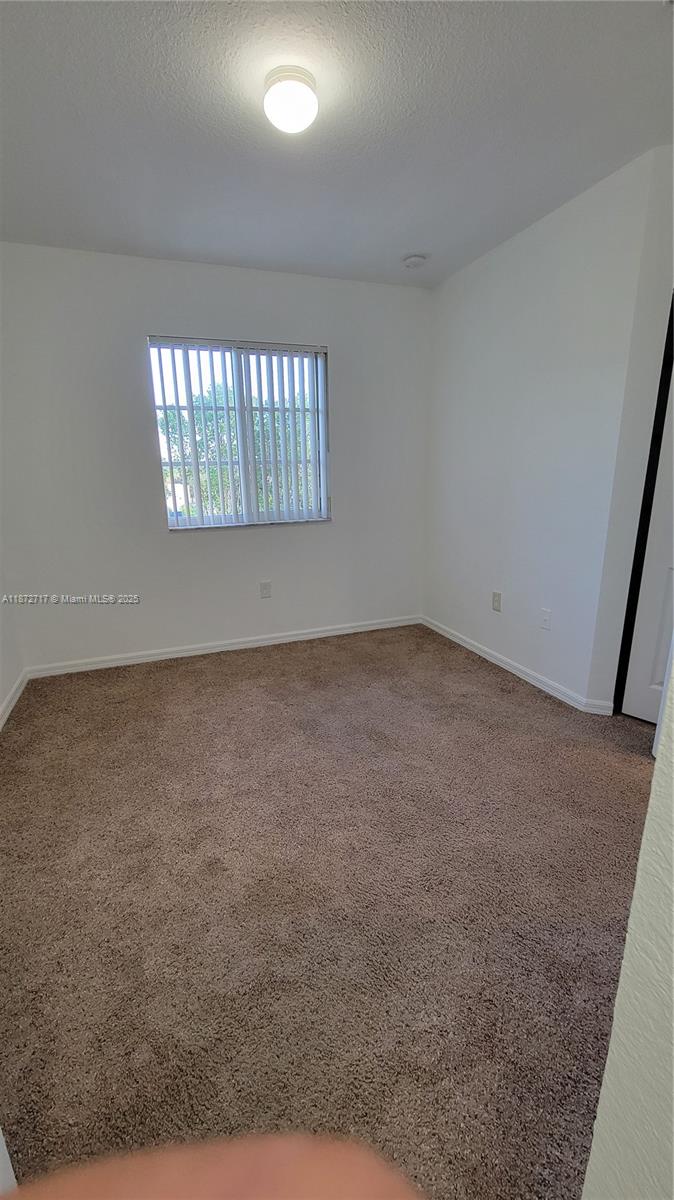 12600 Southwest 50th Court, Unit 437 Miramar, FL 33027 - Photo 15 of 28 an empty room with windows