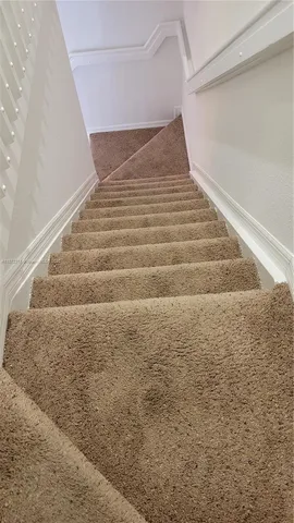 a view of a hallway with a white walls